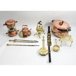 A quantity of various brassware to include a large oval copper pan and cover and a kettle on stand