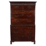 A George III mahogany tallboy, with dentil cornice and fluted frieze,