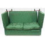 A pair of Knole settees with usual drop ends and cord attachments,