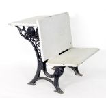 A child's white painted desk/seat on a pierced cast iron support
