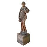 A reconstituted stone garden statue, modelled as a Classical female holding an urn,