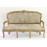 A Louis XV style gilt framed salon settee,