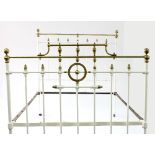 A brass plated and painted double bed frame,