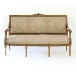 A Louis XVI style gilt framed settee,
