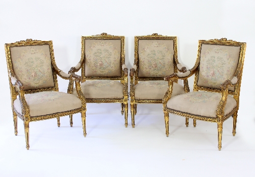 A set of four Louis XVI style gilt framed salon chairs,