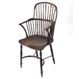 A Windsor type stick back armchair, with dished elm seat,