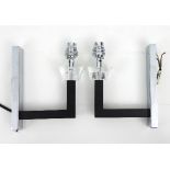 A pair of chromium, ebony and cut glass wall lights,