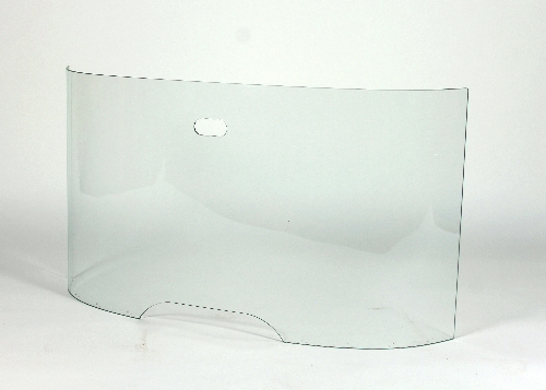 A curved glass fire guard by Pierre Frey, with pierced carry handle,