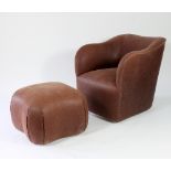 A brown leather upholstered tub armchair by J Robert Scott and a matching foot stool/see