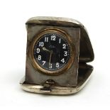 A silver cased travelling bedside clock,