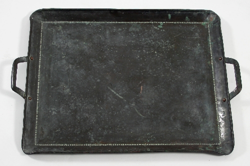 Manner of John Pearson, a copper two-handled tray, 50.