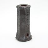 A 16th/17th Century steel fire pot of octagonal form with hollow centre,