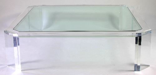 A large Lucite and glass coffee table, the inset glass top with canted corners,