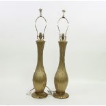 A pair of reeded gilt metal table lamps,