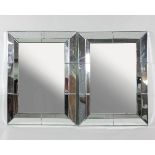 A pair of modern mirror-framed wall mirrors,