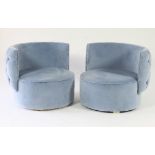 A pair of pale blue velvet circular tub chairs, by Ben Whistler, with button upholstered back,