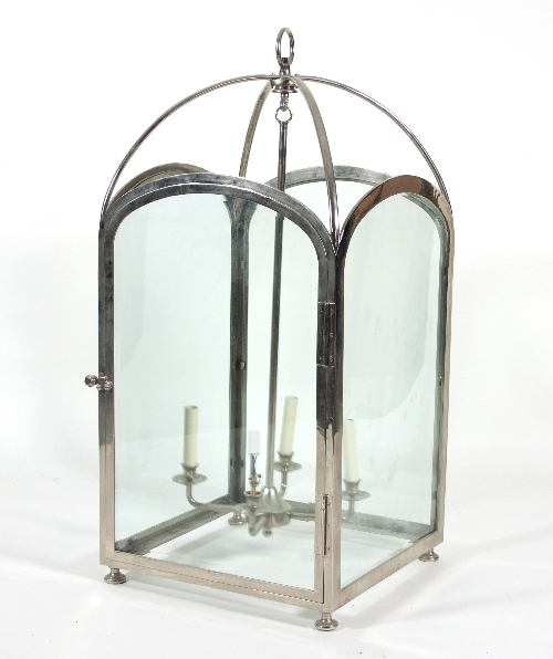 A large chrome and glass hall lantern with four central lights,