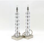 A pair of glass ball table lamps, 50cm high and a moulded glass urn shaped table lamp,