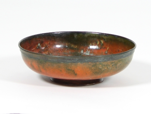 William Hair Haseler: An Arts and Crafts enamelled copper bowl in orange and mottled green on - Image 2 of 2