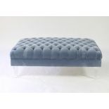 A Fendi pale blue velvet button upholstered footstool on square tapering perspex legs,