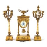 A late 19th Century clock set,