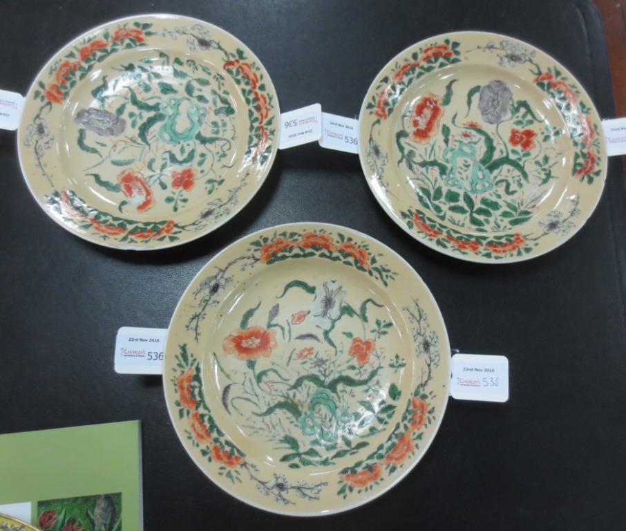 Three Chinese plates, Qianlong circa 1780, enamelled flowering plants to a caramel coloured ground, - Image 2 of 7