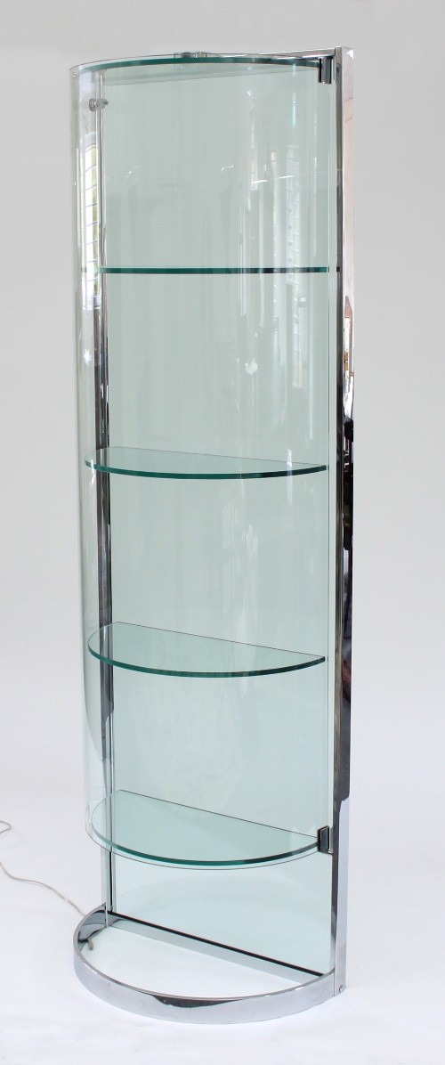 A set of 20th Century chrome framed glass shelves of half round form with chrome frame,