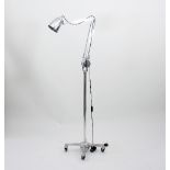 A Hadrill and Horstmann chrome counterpoise floor standing lamp on four-castor trolley base,