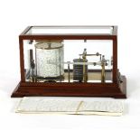 A late Victorian barograph, circa 1900, the mahogany case with bevelled glass top and sides,