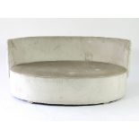 A pale grey velvet sofa, with button upholstered back,