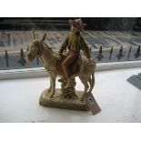 A Royal Dux figure, young boy on donkey, 1989, pink triangle to base. 38cm high.