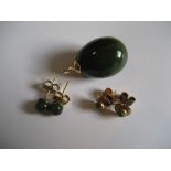 A pair of gold green stone earrings together with pair. A yellow metal green stone pendent. (