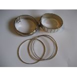 A silver bangle etc (contents of 1 bag).