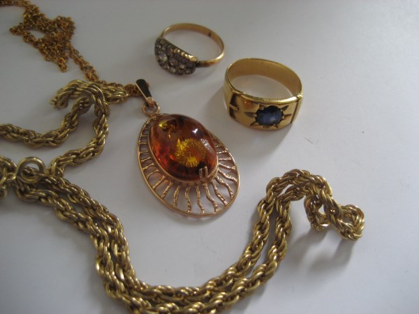 A yellow metal chain, a yellow meta ring etc (the contents of 1 bag).