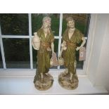 A pair of Royal Dux wine merchant figures, pink triangle mark to base, 1074 and 1075, 50cm high.