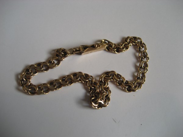 A 15ct gold bracelet, stamped 585 to clasp, 7.9 g.