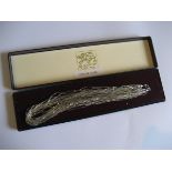 An Elizabeth Duke of Bond Street silver necklace in fitted case.