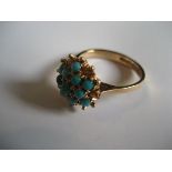 A 14ct gold turquoise stone cluster ring, stamped 585, 3.4g all in.