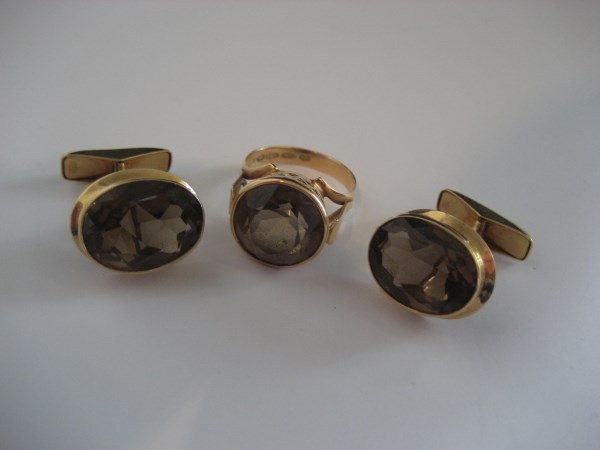 A 14ct gold quartz ring together with 14ct gold quartz earrings (3). 14 g all in.