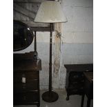 A 20th century mahogany standard lamp.
