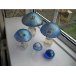 A collection of glass mushroom.