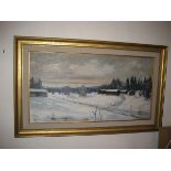 A 20th century oil on canvas depicting a snow covered village, 99cm by 52cm.