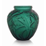 A Sauterelles Vase, No. 888
designed 1912, green and white stained
10 ¾ in. ( 27.5 cm.) high
later