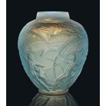 An Archers Vase, No. 893
designed 1921, cased opalescent and blue stained
10 ¾ in. (27.4 cm.) high