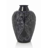 A Lezards et Bluets Vase, No. 879
designed 1913, black and white stained
13 ½ in. (34.2 cm.) high