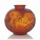 A Poissons Vase, No. 925
designed 1925, cased orange-amber and white stained
9 ½ in. (24.2 cm.) high