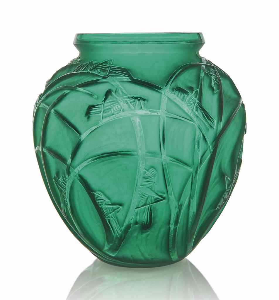 A Sauterelles Vase, No. 888
designed 1912, emerald green and white stained
11 ½ in. (29.3 cm. ) high