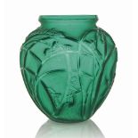 A Sauterelles Vase, No. 888
designed 1912, emerald green and white stained
11 ½ in. (29.3 cm. ) high