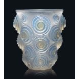 A Spirales Vase, No. 1060
designed 1930, opalescent and blue stained
6 ¾ in. (17.1 cm.) high