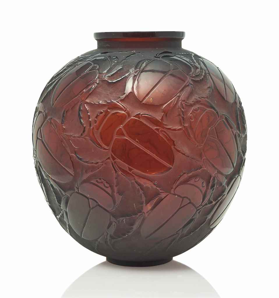 A Gros Scarabees Vase, No. 892
designed 1932, deep amber
11 ¾ in. (30 cm.) high
moulded R.